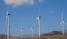 Shot Of Three Wind Turbines On The Background Of Heaven On A Sunny Day