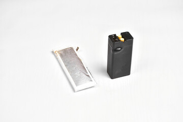 Lithium polymer and lithium ion battery swollen on the white background