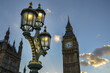 Street lights over a background of the famous Big Ben under a blue, cloudy sky, London