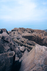 Poster - View of rocky mountains with plants against a gray sky in Itatiaia National Park, Brazil