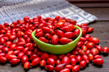 Closeup Of Fresh Red Rosehips On A Table