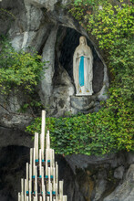 Statue Of Virgin Mary In The Grotto Of Our Lady Of Lourdes, France