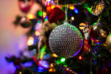 Poster - Beautiful Christmas ornaments and lights hanging in the Christmas tree