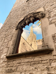 Wall Mural - Vertical shot of a window of The Cathedral of the Holy Cross and Saint Eulalia