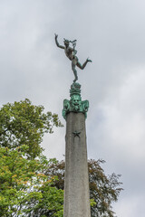 Poster - Beautiful statue in front of a tree in Antwerp, Belgium