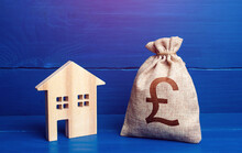 Figurine Silhouette House And British Pound Sterling Money Bag. Maintenance, Property Improvement. Taxes. Mortgage Loan. Proposal For A Deal Price. First Installment. Buying And Selling Real Estate.