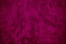 Purple Red Vintage Background. Painted Wall Background With Space For Design. Toned Dark Magenta Rough Surface Concrete Texture. Close-up.