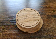 Blank Coaster Stack Mockup With Wood Texture On Wooden Surface. Circular Drink Pad Pile Template