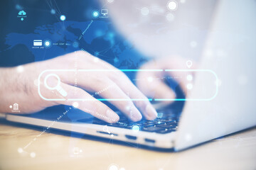 Poster - Close up of hand using laptop computer with creative search bar and digital blue map icons on blurry background. Address and Url concept. Double exposure.