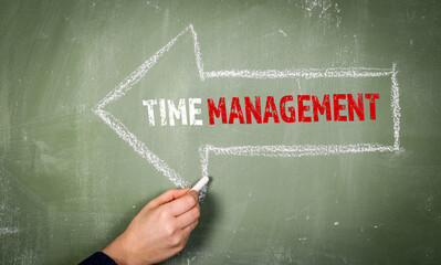 Wall Mural - Time management. White arrow on a green chalkboard