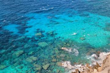 Wall Mural - view above a clear sea blue turquoise and rock in Corsica island at Bonifacio