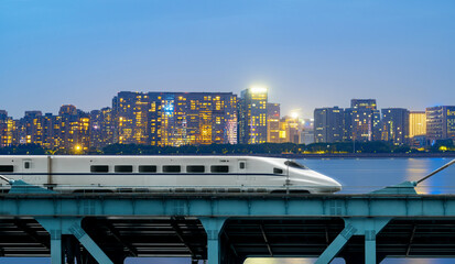 Sticker - High-speed rail speeds on Bridges and the modern city skyline of chongqing, China