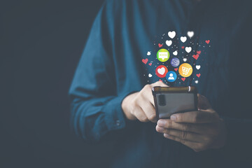 Wall Mural - Social media technology concept, man hand using smartphone Login to the online network Use social media to do business and marketing payment from home through the Internet.