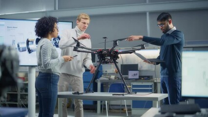 Poster - Diverse Science Specialists Looking at Drone and Talk About It in Scientific Laboratory. Aviation Engineering and Breakthrough in Aviations Concept