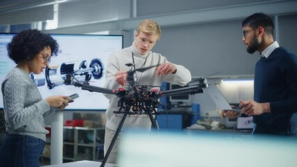 Poster - Diverse Aviation Engineers Building, Sets Up, Configuring and Testing Drones while Work at Factory. Aviation Industry and Startup Concept. Slow Motion