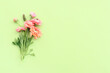 Leinwandbild Motiv Top view image of pink flowers composition over green wooden background