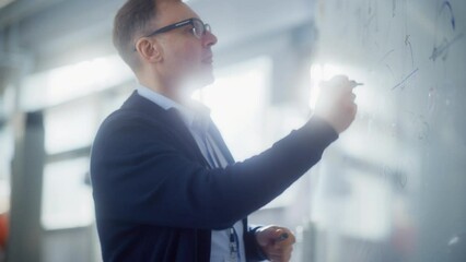 Poster - Creative Scientist Man Wearing Glasses Illustrate Working Methods and Draw Statistical Charts on Whiteboard. Science, Conceptuality and Problem Solving Concept