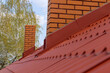 © ungvar - Roof housetop with red roofing metal tiles for roofers