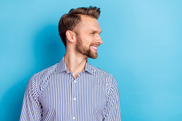 Wall Mural - Portrait of good looking handsome male visit barbershop look blank space isolated on blue color background