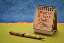 Caribbean American Heritage Month - Handwriting In A Small Desktop Calendar Against Abstract Paper Landscape, Reminder Of The Annual Cultural Event