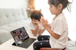 © FAMILY STOCK - Asian little girl taking class on line and happy for Homeschool Quarantine coranavirus pandemic concept