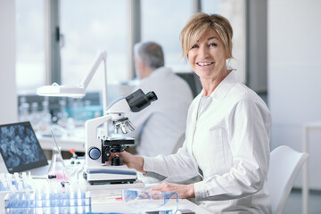 Wall Mural - smiling researcher working in the lab