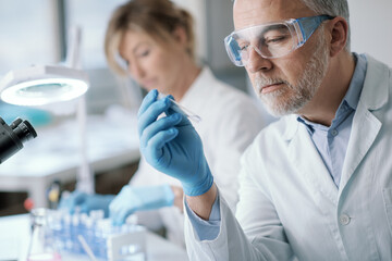 Wall Mural - professional researcher holding a test tube