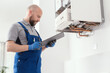 © StockPhotoPro - Professional boiler service at home