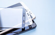 © Alexandra - maintenance and repairing smartphones. many tempered glass screen protector and mobile phone, replace concept. mobile screen replacement protector, repair kit. installation of protective cover film