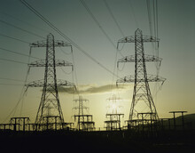 Silhouette Of Electricity Pylons