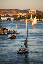 Egypt, Aswan, Sailboats On Nile River At Sunset