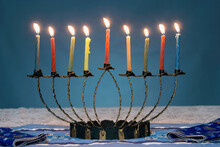 Close-up Of Lit Candles On A Menorah