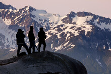 Hikers On A Hilltop, Reid Glacier, Glacier Bay National Park, Alaska, USA