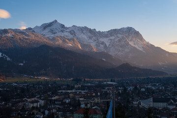 Wall Mural - Landscape with view of Garmisch-Partenkirchen at sunset