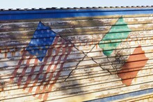 Mexico, Tecate, US And Mexican Flags On Border Fence