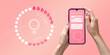 Menstrual cycle tracker mobile app on the smartphone screen in the hands of a woman. Modern technologies for tracking women's health, pregnancy planning