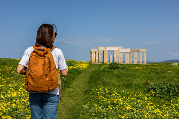 Interesting historical places. Girl tourist with a backpack.