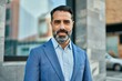 © Krakenimages.com - Middle age businessman smiling happy standing at the city.