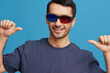 © SHOTPRIME STUDIO - portrait man in blue t-shirt 3d glasses entertainment gesture with hands cropped view