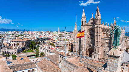 Wall Mural - Aerial view of the Spanish flag near the La Seu, the gothic medieval cathedral of Palma de Mallorca in Spain