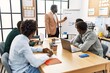 © Krakenimages.com - Group of african american business workers listening boss conference during work meeting at the office.