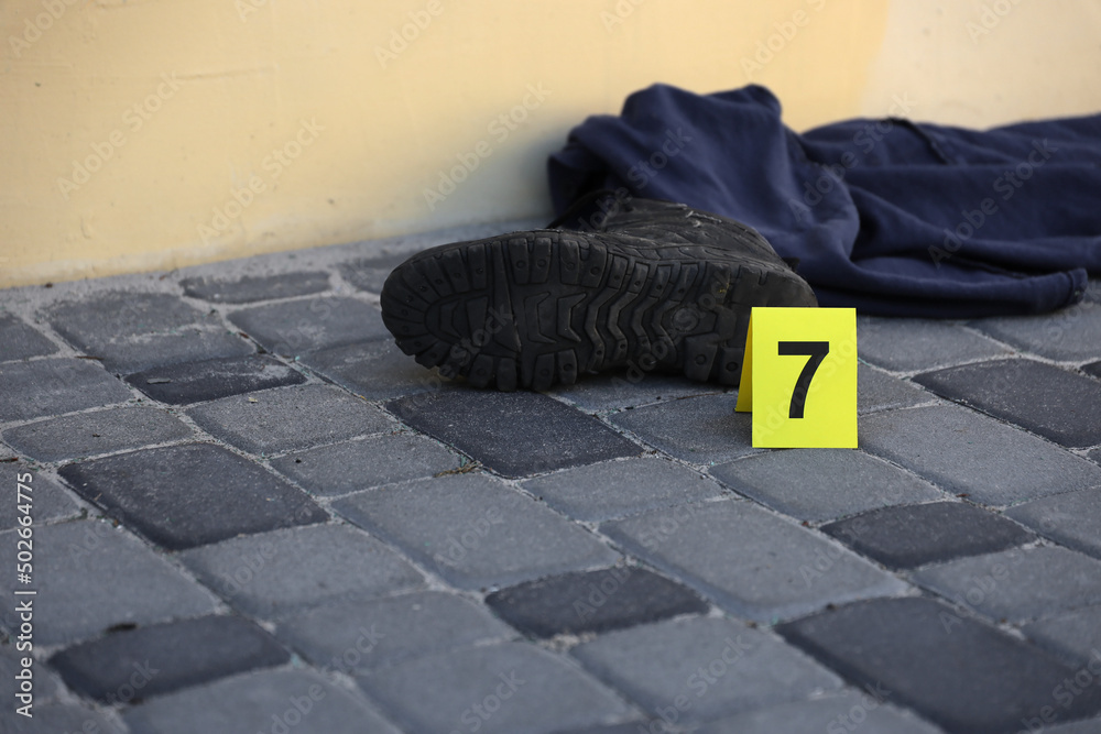 Evidence with yellow CSI marker for evidence numbering on the ...