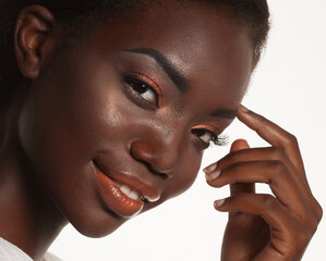 Wall Mural - Portrait of Young African model with a beautiful makeup in studio