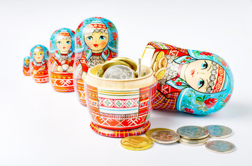 Wall Mural - Traditional Russian toy matryoshka and money. White background. Copy space