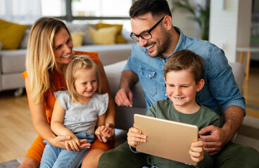 Wall Mural - Device technology family online education concept. Happy family with digital devices at home.