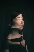 Fine Art Double Exposure Studio Portrait Of An Asian Girl In Black