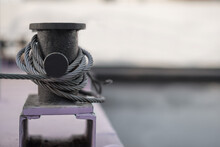 .black Bollard With A Coiled Cable Close-up