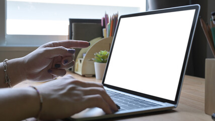 Wall Mural - Woman working online, surfing internet with laptop computer at home.