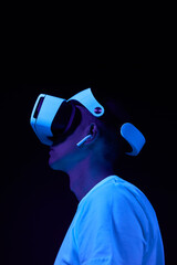 Wall Mural - man interting with virtual reality using vr headset.