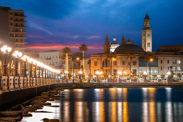 Wall Mural - Panoramic view of Bari, Southern Italy, the region of Puglia(Apulia) seafront at dusk. Basilica San Nicola in the background. 